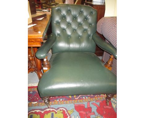 Victorian green button leather upholstered open arm library chair on low turned front supports