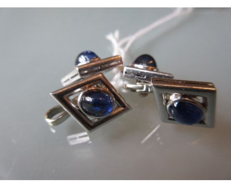 Pair of platinum cufflinks set four cabochon sapphires