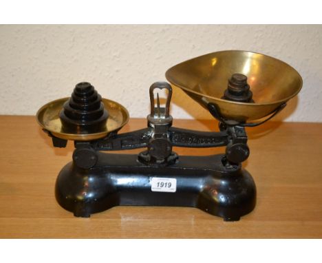 Pair of black painted Librasco iron and brass kitchen pan scales with weights
