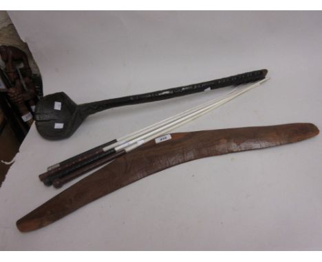 Aboriginal boomerang with etched decoration, an African ladle and four riding crops