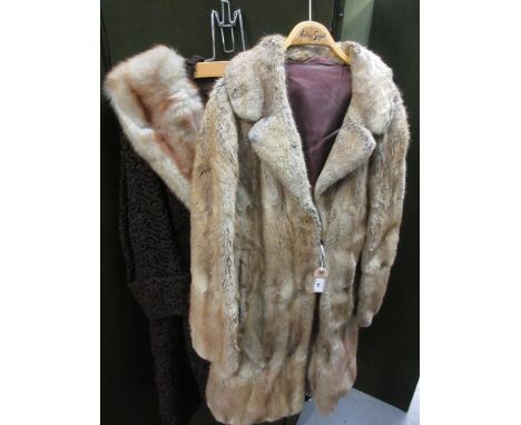 Ladies three quarter length light coloured fur coat, together with another fur collared sheepskin three quarter length coat