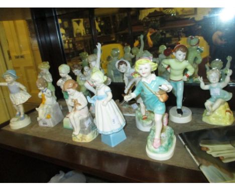 Set of fourteen Royal Worcester ' Days of the Week ' figures (seven boys and seven girls), black marks, varying heights from 