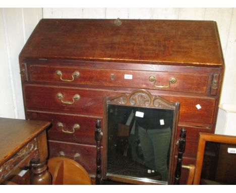 George III oak bureau with a fall front above four graduated drawers, with brass swan neck handles on bracket supports