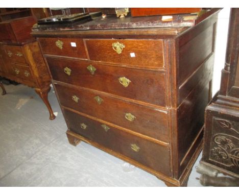 18th Century oak chest of two short over three long graduated drawers with brass swan neck handles and engraved key escutcheo