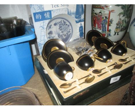 Cased part set of Royal Worcester black and gilt coffee cups with saucers together with six silver gilt spoons