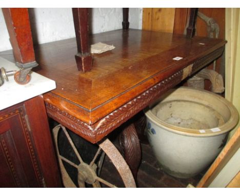 19th Century Anglo Indian rectangular hardwood tilt top pedestal table with a carved tripod base