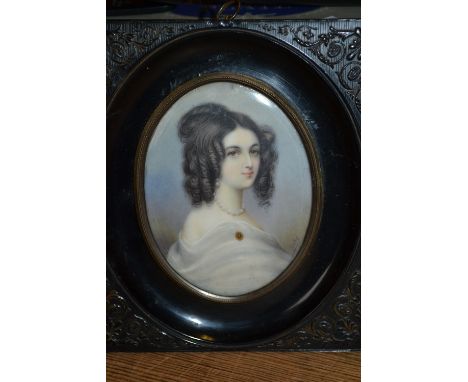 19th Century oval mounted portrait miniature of a lady with her hair in ringlets, signed Bietre, in an ebonised frame