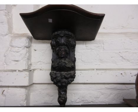 Carved walnut clock bracket