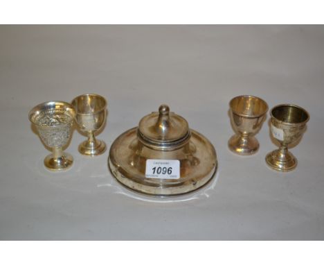 Silver capstan inkwell together with four silver egg cups