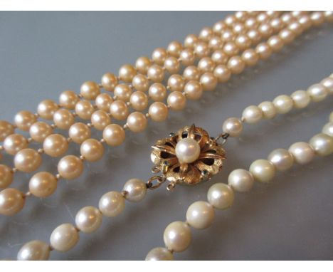 Single row uniform cultured pearl necklace with a 9ct gold clasp, together with a simulated cultured pearl necklace