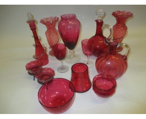 Pair of Victorian cranberry glass vases together with a cranberry glass decanter and other cranberry glass items