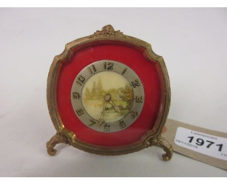 Small early 20th Century dressing table strut clock with ormolu frame