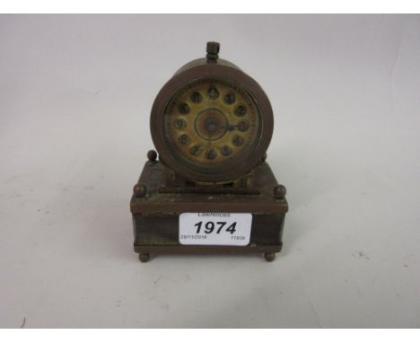 Small German brass table clock together with a black slate two train mantel clock for restoration