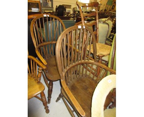 Two 20th Century Windsor stick back armchairs together with a Victorian wood and iron adjustable reading table