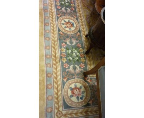 Good quality Chinese carpet with a typical embossed Aubusson style floral medallion design with yellow ground and blue ground