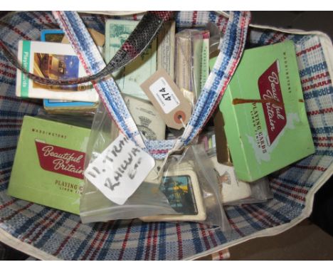 Assorted collection of various playing cards including trains and railways