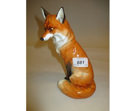 Royal Worcester figure of a seated fox, 7.25ins high, black mark
