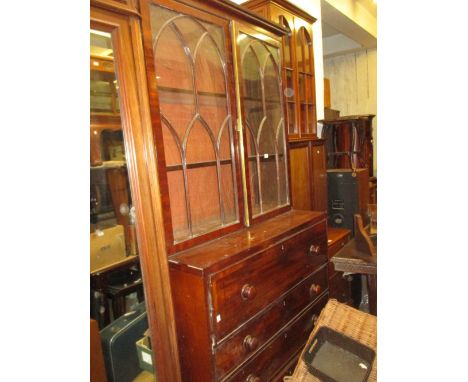 Late George III mahogany and black line inlaid secretaire bookcase, the moulded cornice above two arched glazed doors, the ba