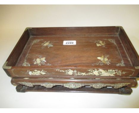 Late 19th or early 20th Century Chinese hardwood and mother of pearl inlaid desk stand with key pattern and floral decoration