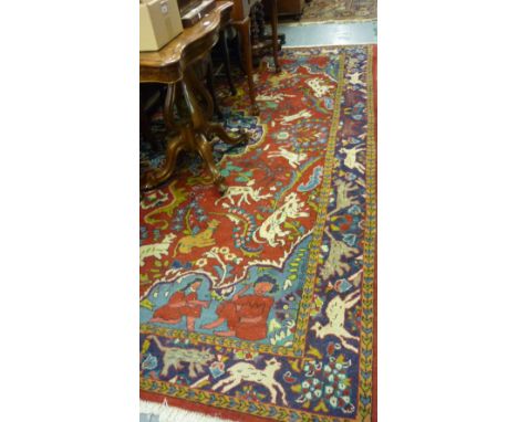 Indo Persian carpet having central medallion surrounded by various animals with multiple borders and red ground, 6.5ft x 10ft