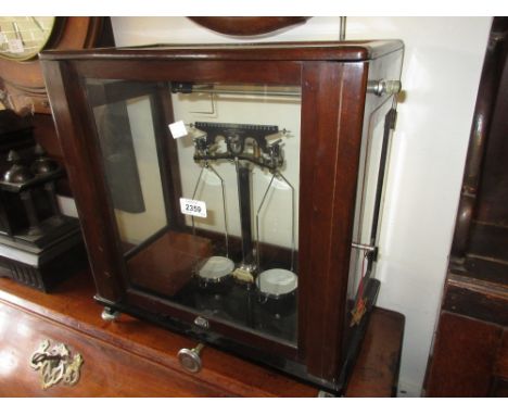 Pair of early 20th Century mahogany cased laboratory scales