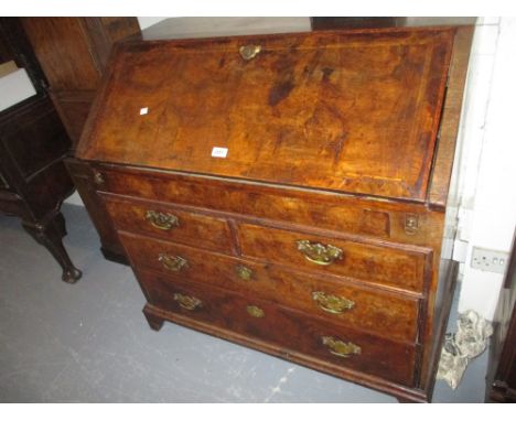 18th Century walnut herringbone crossbanded bureau, the fall front housing a fitted interior above two short and two long dra