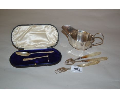 Pair of Victorian silver forks with mother of pearl handles, another similar fork, a London silver cream jug and a cased silv