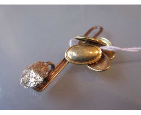 Pair of oval 9ct gold cufflinks and a tie-pin