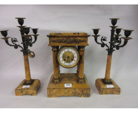 Yellow marble three piece clock garniture, the movement with outside count wheel striking on a bell, the side pieces in the f