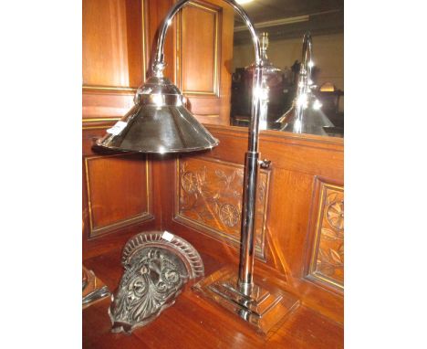 Nickel plated adjustable desk lamp on circular stepped base