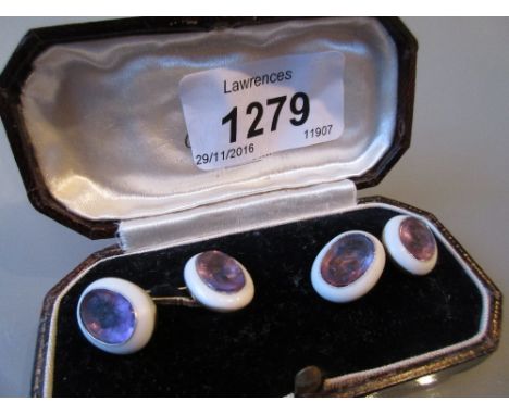 Pair of French yellow gold cufflinks set with four carved amethyst portrait panels
