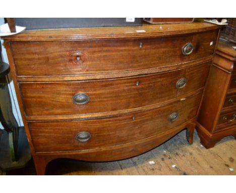Regency mahogany bow front chest, the reeded top above three graduated drawers with brass oval ring handles on splay bracket 