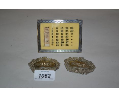 Birmingham silver mounted calendar together with a pair of plated decanter labels