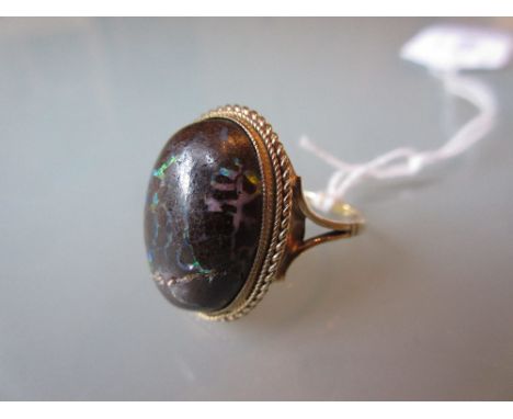 Gold ring set wood opal