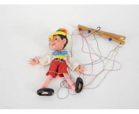 A Pelham Puppet Pinocchio puppet, boxed.
