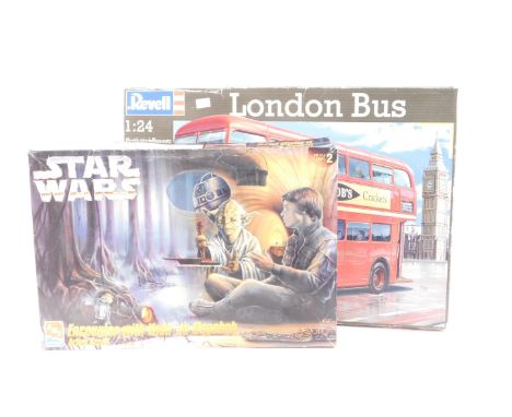 A Revell London Bus plastic model kit, 1:24 scale, and an Ertl AMT Star Wars Encounter with Yoda on Dagobah action scene mode