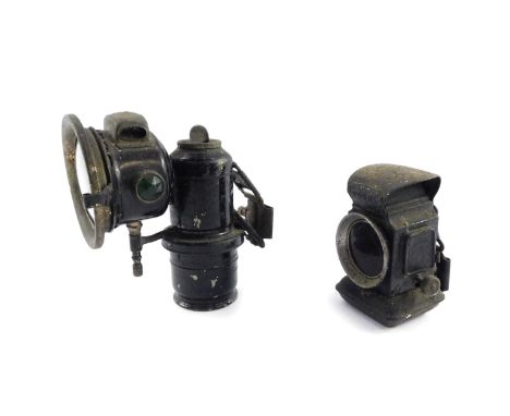A Lucas black painted bicycle carbide lamp, together with a further bicycle lamp. (2)