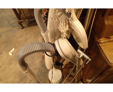 Stone base standing lamp with a modern anglepoise lamp and two ottlite adjustable tube lamps. Not available for in-house P&am