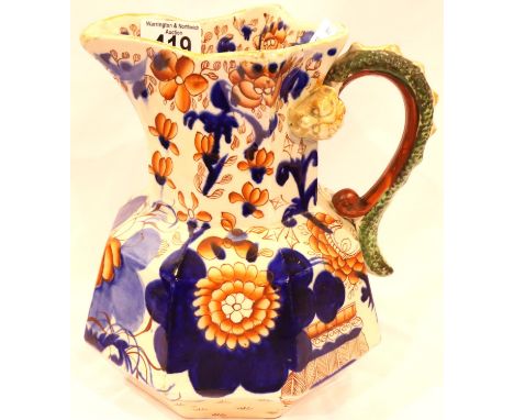 An early Ironstone ceramic pitcher of large proportions, moulded dragon handle and decorated in the Imari palette, H: 21 cm. 