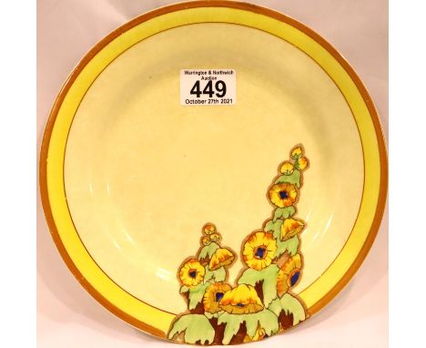 Clarice Cliff; a Bizarre painted cabinet plate in the Sunshine pattern, D: 22 cm. Repair to rim and crazed throughout. P&amp;