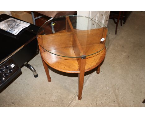 An Art Deco design circular coffee table with plate glass top, ex. Fisons Harvest House Felixstowe 