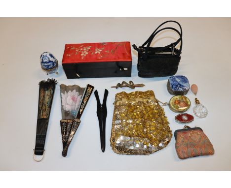 A box of assorted items to include fabric covered jewellery box, a Liberty of London purse, other purses, two fans, a perfume