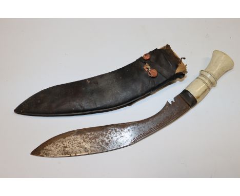 A bone handle curved dagger and scabbard 