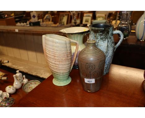 A Studio pottery vase with impress mark and three Art Deco design jugs 