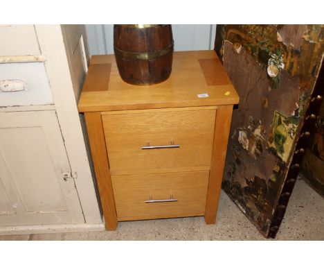 A modern light wood filing cabinet of two drawers 