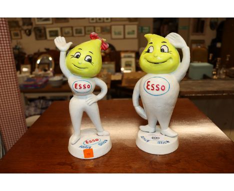 A pair of cast iron Esso money banks 