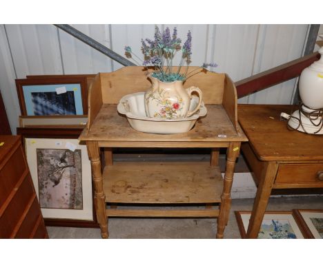 A Victorian stripped pine tray top washstand; and a floral decorated toilet jug and basin