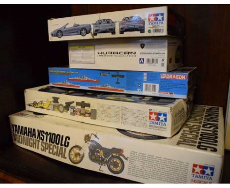 Three Tamiya model kits comprising; 1:12 scale John Player Special J.P.S. Lotus 72D, 1:6 scale Yamaha XS1100LG Midnight Speci