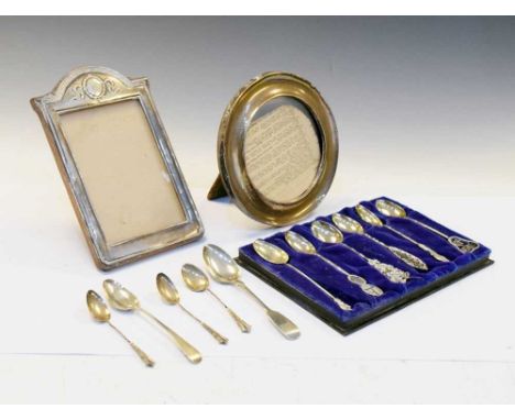 Two George V silver easel picture frames, Birmingham 1912, together with a selection of silver and white-metal spoons, 125g a