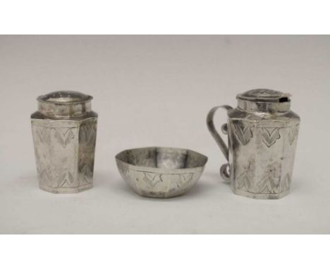 Eastern three-piece white-metal cruet set of octagonal form with engraved decoration, the base marked HK, mustard 5cm high, 6
